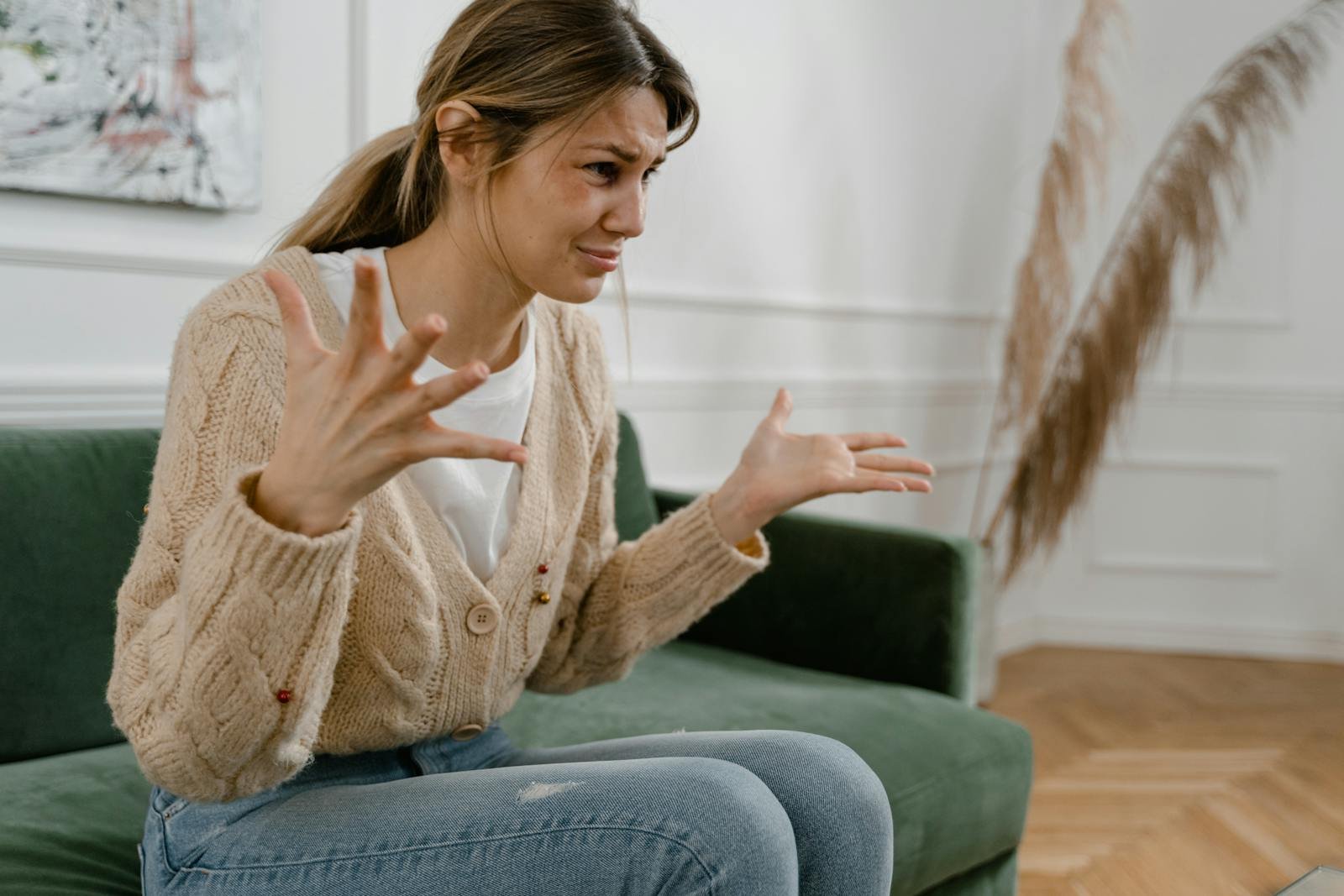 A Sad Woman Sitting on a Sofa